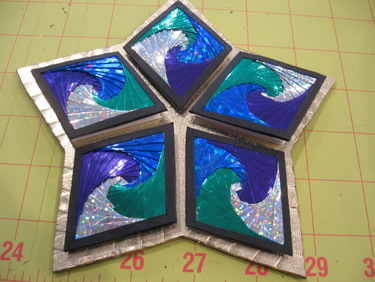 A piece by Jill Abilock - exterior of a book using Iris folding for the covers